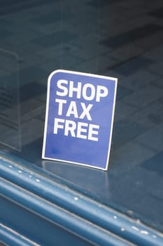 shop tax free text duty free shop sign on shop window ,