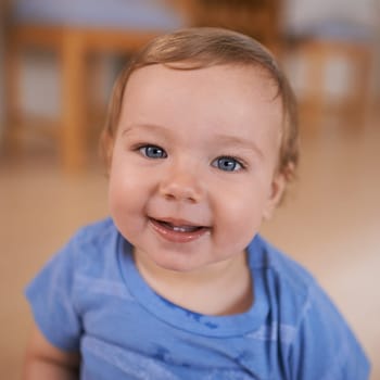 Toddler, smile and portrait of baby in home for fun playing, happiness or learning in living room. Relax, healthy boy or face of a male kid on floor for child development or growth in a house alone.