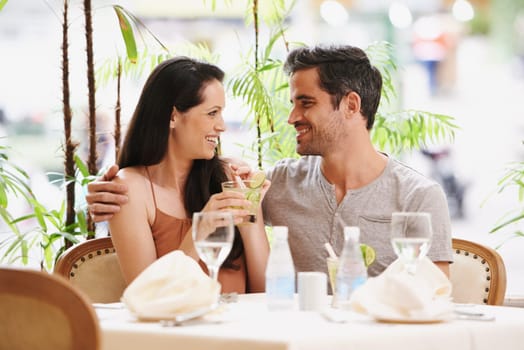 Couple, restaurant and drinks with lunch, romance and love for anniversary or celebration. Woman, man and date with luxury, fine dining and smile for relationship on holiday or vacation with meal.
