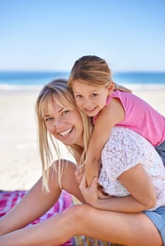 Portrait, mother and smile of kid on beach for vacation, summer or holiday with piggyback on blanket. Face, mom or happy girl at ocean for adventure, travel or family bonding together on mockup space.