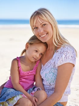 Portrait, mom and happy kid on beach for holiday, summer or child on vacation to relax in nature. Face, mother or smile of girl at ocean on adventure, travel or family bonding together outdoor by sea.