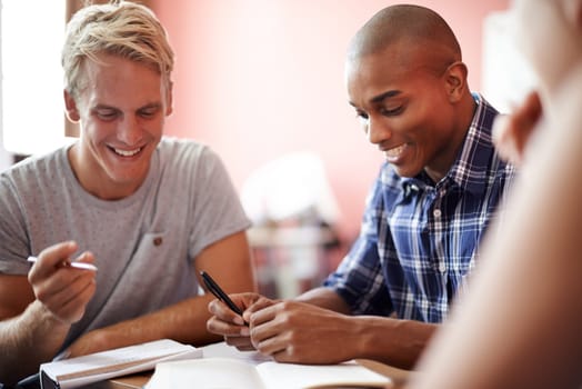 Students, class and writing notes in university, learning and knowledge on college campus. Education, men and diversity for information in book, teamwork and communication for studying or revision.