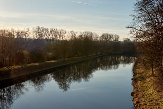 Autumn Beauty along the Narrow River Neckar in Germany. Scenic Views of Fall Splendor. Discover the enchanting autumn landscapes of Germany along the narrow river Neckar. Immerse yourself in the beauty of fall with picturesque scenes capturing the vibrant colors and scenic views of the season.