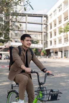 The businessman eco friendly transportation, cycling through the city avenues to go to work. sustainable lifestyle concept.