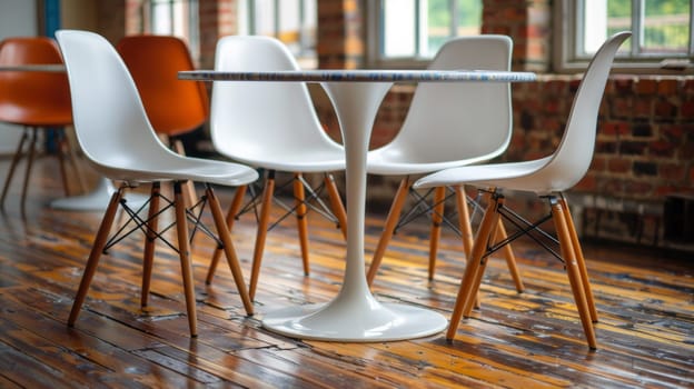 A table and chairs in a room with hardwood floors