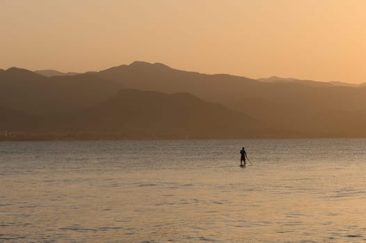 man doing SUP boarding on the Mediterranean Sea 6