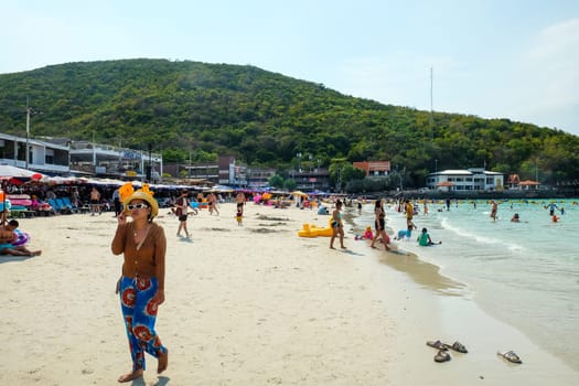 PATTAYA, THAILAND -MARCH 25 2024: Unidentified people on the beach in Nual Beach at Koh Lan, Pattaya, Chonburi Province,Thailand