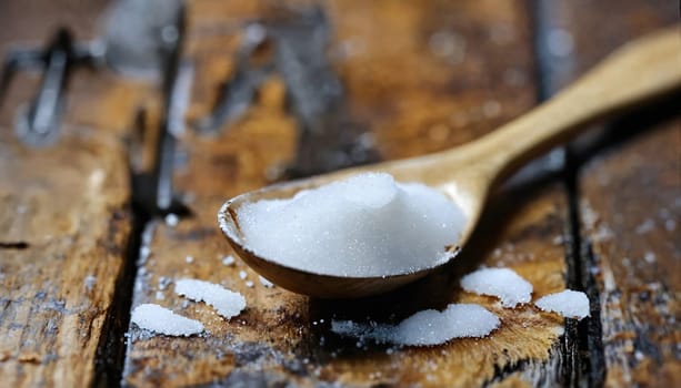 Sugar and salt in a spoon. Generative AI. High quality photo