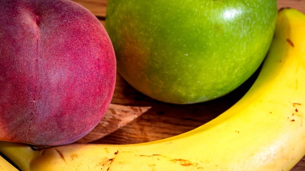 Mix of fresh fruits on wooden table