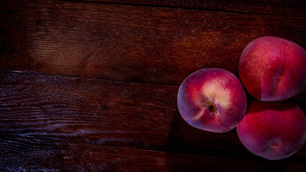 Fresh juicy peaches on rustic wooden table