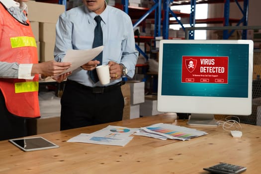 Computer with green screen display in warehouse storage room . Delivery and transportation software concept .