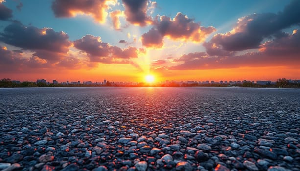 The perspective of the road against the background of sunset and the cityscape. High quality photo