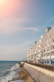 coastal area with apartment buildings of residential areas, modern hotel and restaurant complex on water and sandy beaches