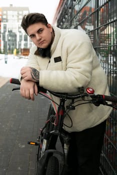 Sports concept, young man looking stylish with a bicycle.