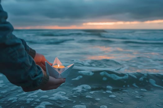 A person stands at the twilight ocean's edge, releasing a paper boat with a lit candle into the gentle waves as a poignant tribute. The horizon glows softly in the distance