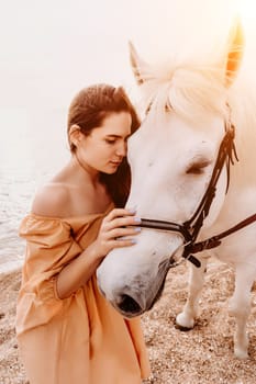 A white horse and a woman in a dress stand on a beach, with the sky and sea creating a picturesque backdrop for the scene