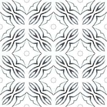 Textile ready stylish print, swimwear fabric, wallpaper, wrapping. Black and white likable boho chic summer design. Watercolor ikat repeating tile border. Ikat repeating swimwear design.