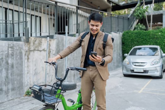 Businessmen ride bicycle to work to reduce carbon dioxide emissions and reduce global warming.