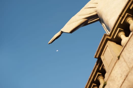 Jesus christ, statue and heritage for travel and christian art for religion or faith journey. Hands, history monument or closeup of sacred destination or culture sculpture in rio de janeiro on hill.