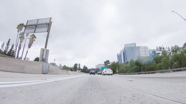 Los Angeles, California, USA-December 4, 2022-POV-Amidst a rainy winter day, driving on HWY 134 near Los Angeles, California, captures the atmosphere through raindrop-covered lenses, adding a unique and moody perspective to the journey.