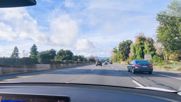 Los Angeles, California, USA-December 4, 2022-POV-Driving on HWY 101 near Santa Barbara, California, the road is shrouded in cloudiness during winter, creating a moody atmosphere while still showcasing the beauty of the coastal landscape.