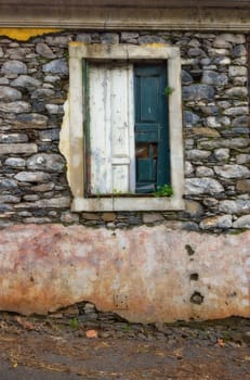 Old, window and dirty exterior with brick wall of abandoned house, building or concrete frame with broken doors. Historic outdoor decor of architecture, texture or rubble from damage, decay or wreck.