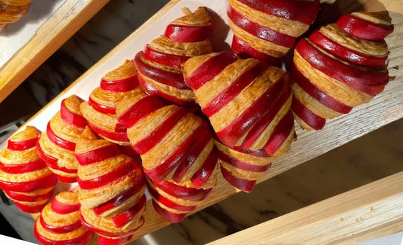 Close up of group of fresh baked delicious christmas croissants, super delicious warm fresh buttery Croissants and Rolls, French and American Croissants and baked pastries are enjoyed world wide on bakery shop, tasty multiple croissant