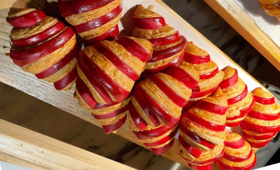 Close up of group of fresh baked delicious christmas croissants, super delicious warm fresh buttery Croissants and Rolls, French and American Croissants and baked pastries are enjoyed world wide on bakery shop, tasty multiple croissant