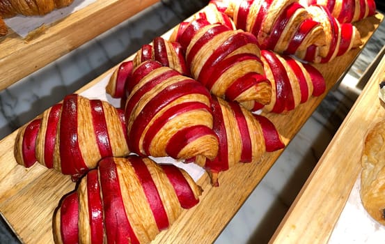 Close up of group of fresh baked delicious christmas croissants, super delicious warm fresh buttery Croissants and Rolls, French and American Croissants and baked pastries are enjoyed world wide on bakery shop, tasty multiple croissant