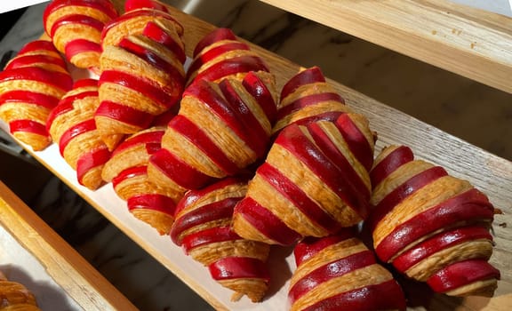 Close up of group of fresh baked delicious christmas croissants, super delicious warm fresh buttery Croissants and Rolls, French and American Croissants and baked pastries are enjoyed world wide on bakery shop, tasty multiple croissant