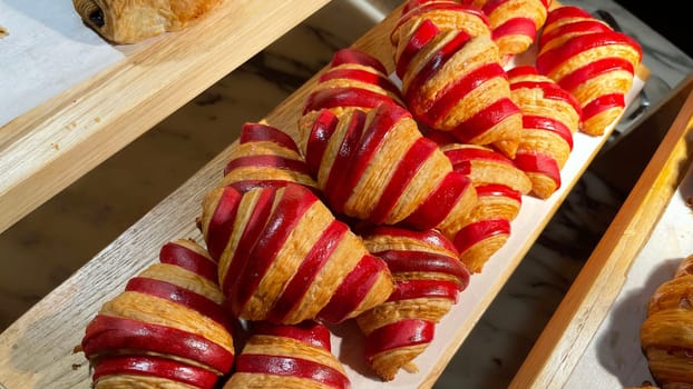 Close up of group of fresh baked delicious christmas croissants, super delicious warm fresh buttery Croissants and Rolls, French and American Croissants and baked pastries are enjoyed world wide on bakery shop, tasty multiple croissant