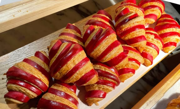 Close up of group of fresh baked delicious christmas croissants, super delicious warm fresh buttery Croissants and Rolls, French and American Croissants and baked pastries are enjoyed world wide on bakery shop, tasty multiple croissant