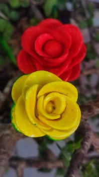 beautiful red and yellow artificial rose flowers. High quality photo