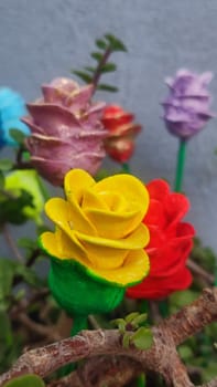 beautiful red and yellow artificial rose flowers. High quality photo