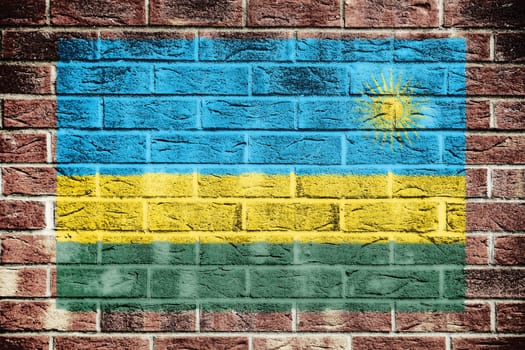 A Rwanda flag on old brick wall background