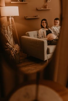 an incredibly beautiful married couple Expecting child, pregnant wife. Happy parenthood, real Ukrainian young family. romantic, gentle, stylish photo session of married couple. pregnant woman in love