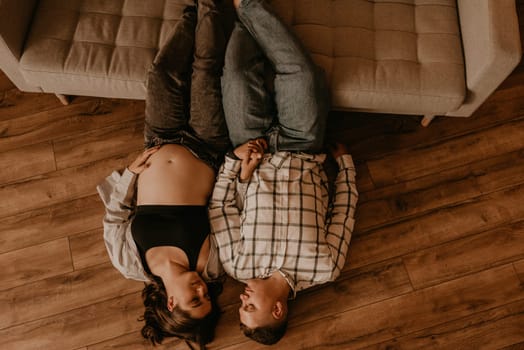 an incredibly beautiful married couple Expecting child, pregnant wife. Happy parenthood, real Ukrainian young family. romantic, gentle, stylish photo session of married couple. pregnant woman in love