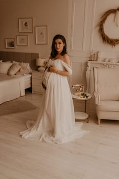 an incredibly beautiful married couple Expecting child, pregnant wife. Happy parenthood, real Ukrainian young family. romantic, gentle, stylish photo session of married couple. pregnant woman in love