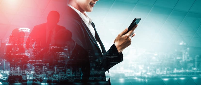 Double Exposure Image of Business Communication Network Technology Concept - Business people using smartphone or mobile phone device on modern cityscape background. uds