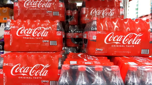 Denver, Colorado, USA-February 28, 2024-At Sam’s Club, the shelves are stocked with bulk multipacks of Coca-Cola Original Taste, their iconic red branding a familiar sight, ready for members to enjoy the classic flavor.