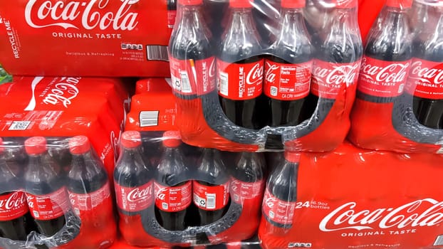 Denver, Colorado, USA-February 28, 2024-At Sam’s Club, the shelves are stocked with bulk multipacks of Coca-Cola Original Taste, their iconic red branding a familiar sight, ready for members to enjoy the classic flavor.