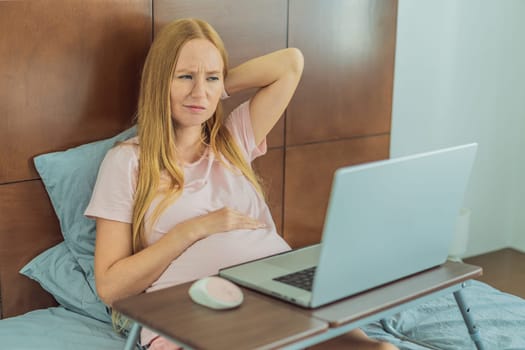 Weary pregnant woman, tired of working from home, navigates the challenges of balancing professional tasks with pregnancy demands.