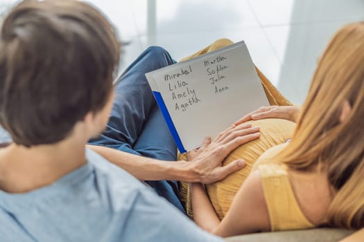 Expectant couple joyfully selects a name for their unborn daughter, savoring the special moment of choosing a meaningful identity for their growing family.