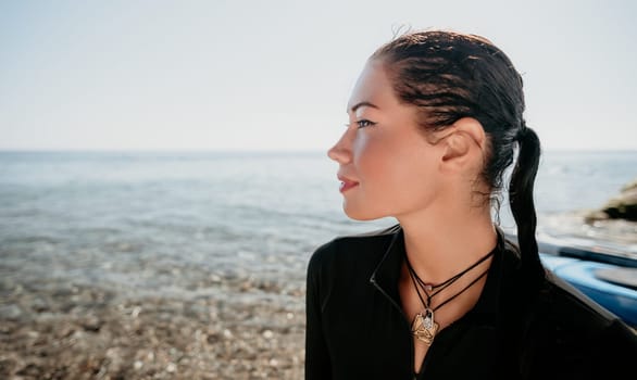 Woman travel sea. Young Happy woman posing on a beach near the sea on background of volcanic rocks, like in Iceland, sharing travel adventure journey