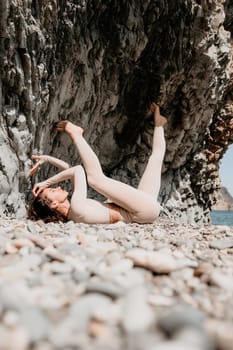 Happy young attractive brunette woman in red swimsuit, on the beach and sea background. Holiday vacation and travel concept.