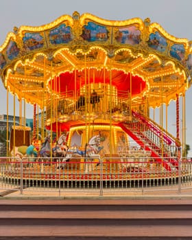 carousel attraction with horses close-up in the park. photo