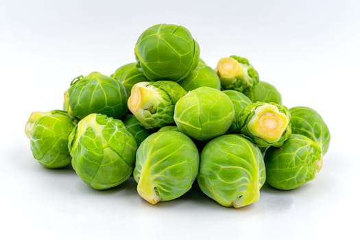 Small heap of brussels sprouts on white background. Neural network generated image. Not based on any actual scene or pattern.