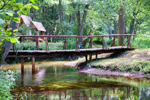 A wooden bridge over a stream