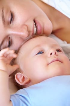 Baby, bonding and happy with mom, relaxing and love together with child and care for motherhood. Infant, mother and smile for affection, nurture and home for growth and babysitting with family.