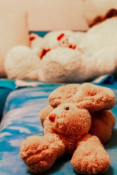 Brown cute bunny stuffed animal on a blue background Blanket in Leherheide Bremerhaven Bremen Germany.